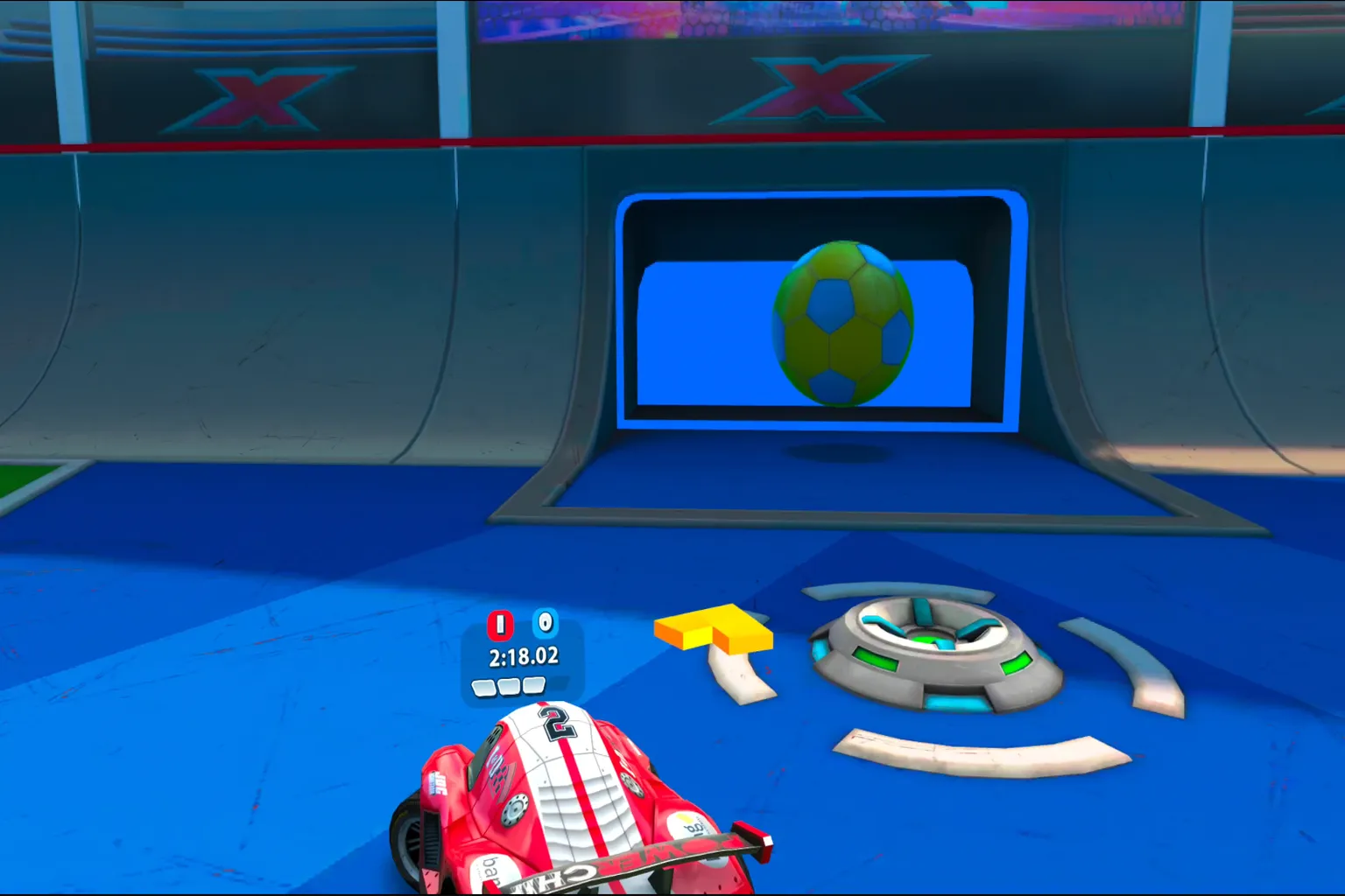 Soccer mode scoring moment where the player’s car pushes a giant ball into the goal to score a point.