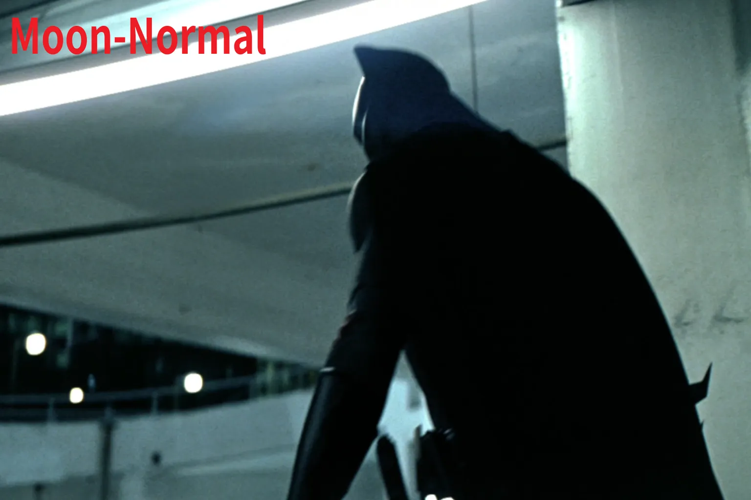 Playing a The Dark Knight scene in Moon VR Player, with Normal mode lacking contrast and losing detail in dark areas.