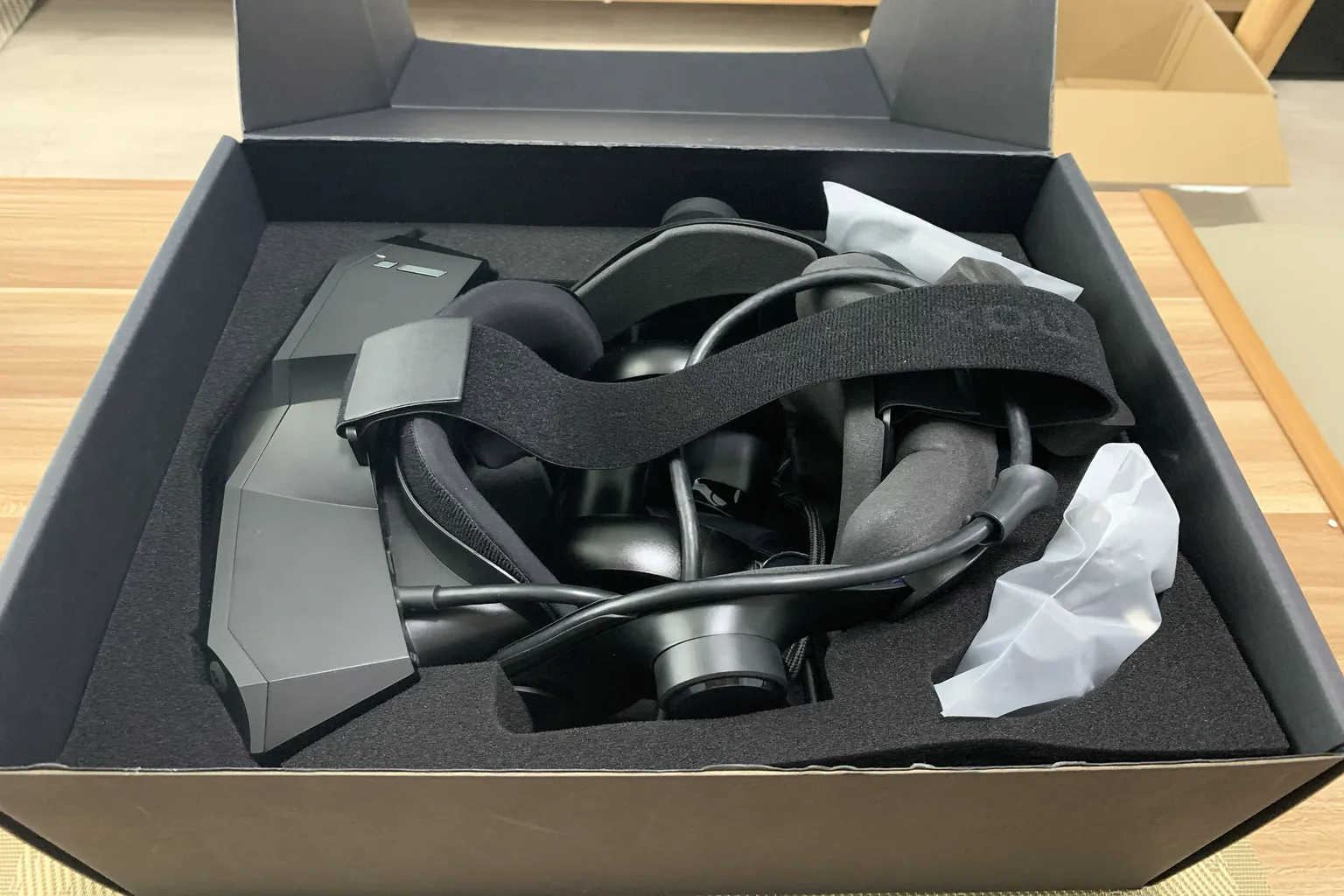 Pimax VR headset packed inside the box with foam protection and accessories still covered.