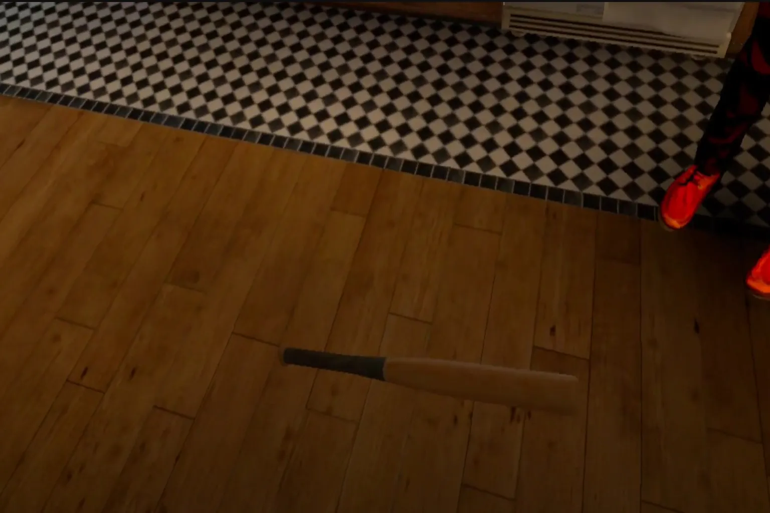 Une batte tourne au-dessus du sol comme une toupie dans Drunkn Bar Fight 2.