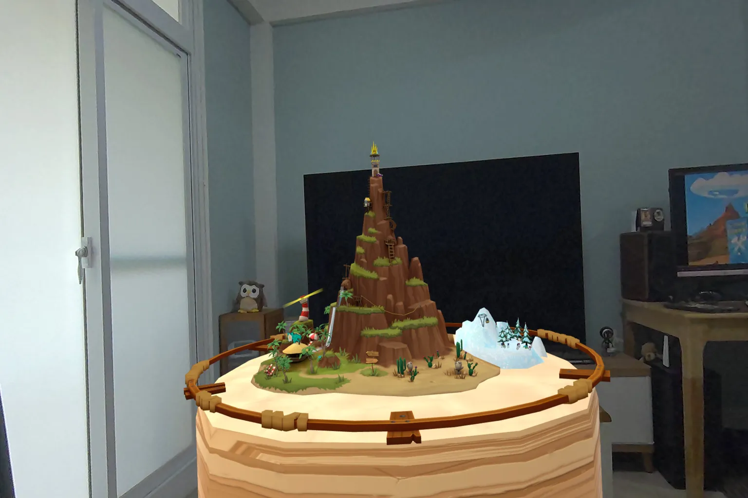 自宅のリビングに浮かぶ Angry Birds VR Isle of Pigs の火山マップ。テーブル上に立体的な島がAR表示されている